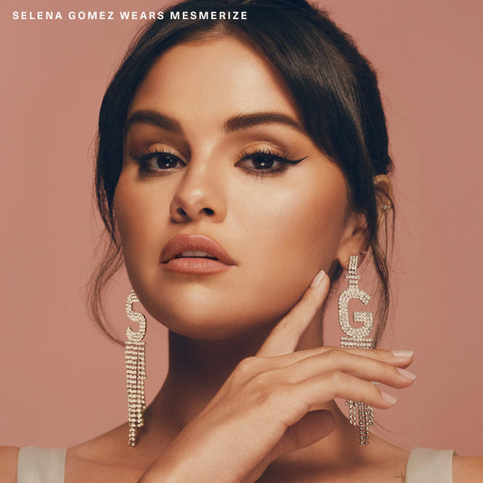 Rare Beauty Positive Light Silky Touch Highlighter applied on skin worn by Selena Gomez in Mesmerize