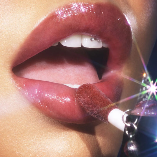 e.l.f. Glow Reviver Lip Oil Glimmer applied on lips for glossy sparkling look