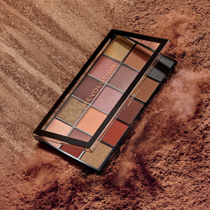 Revolution Reloaded Velvet Rose Palette with a partially open lid on a bronze powder background