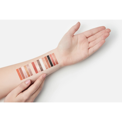 Makeup Revolution Maxi Reloaded Large It Up eyeshadow swatches showing matte and shimmer shades on an arm