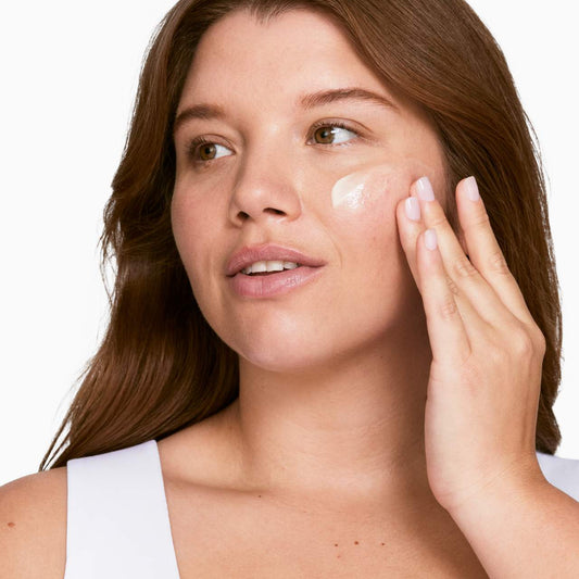 Applying Clinique Dramatically Different Moisturizing Lotion+ on face for hydration