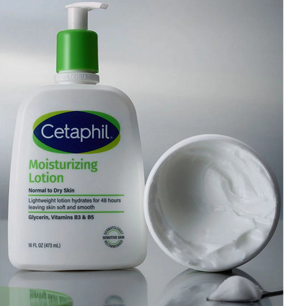 Cetaphil Moisturizing Lotion bottle with cream sample on gray background