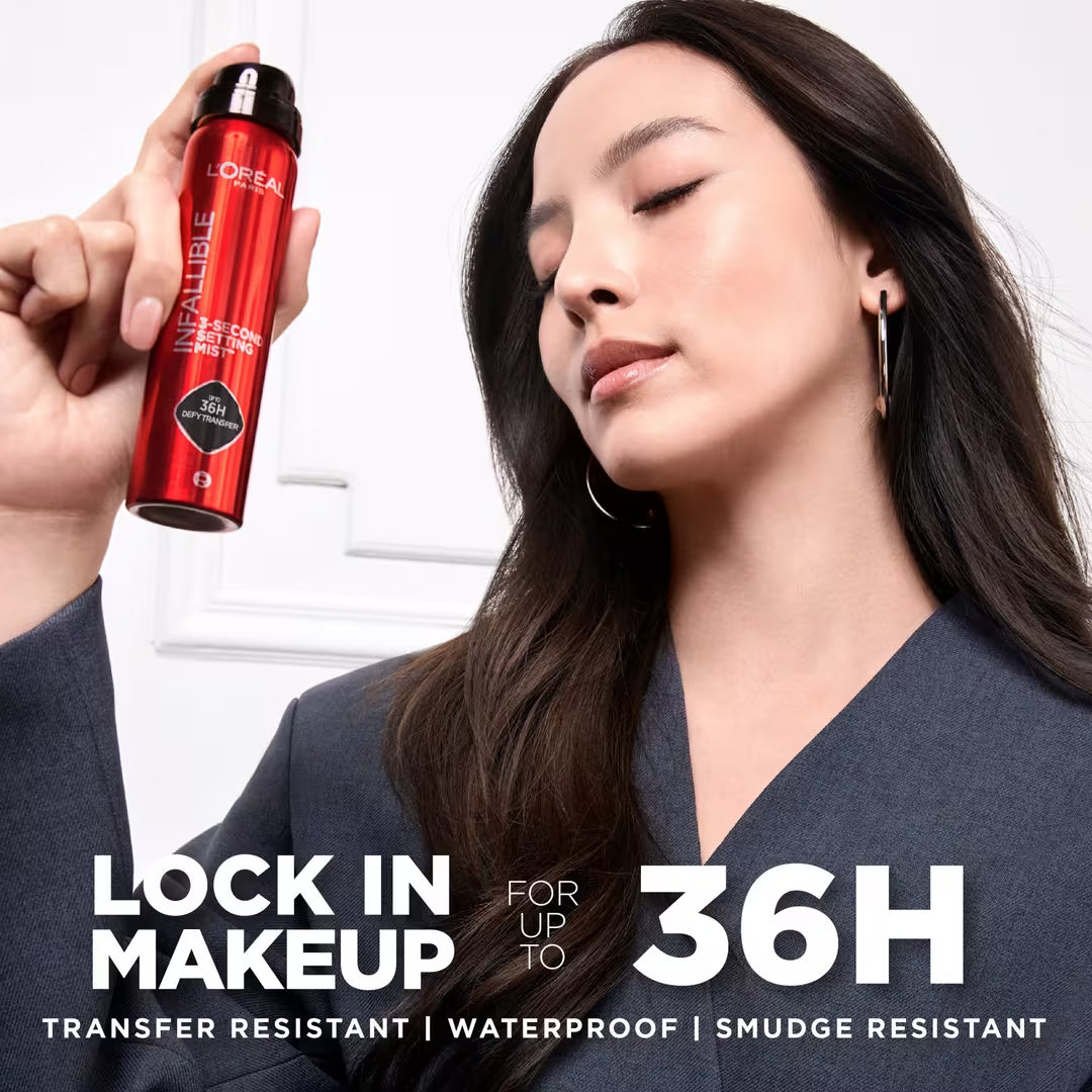 Model applying L'Oréal Infallible 3-Second Setting Mist for up to 36-hour makeup wear.