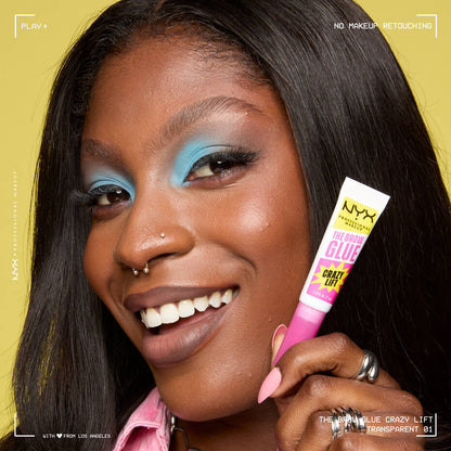 Model holding NYX The Brow Glue Crazy Lift on yellow background