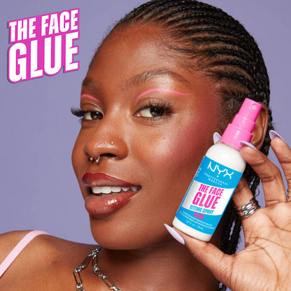 Model holding NYX The Face Glue setting spray for long-lasting makeup