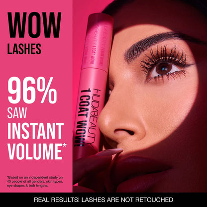 Model wearing Huda Beauty 1 Coat WOW mascara for instant volume lashes