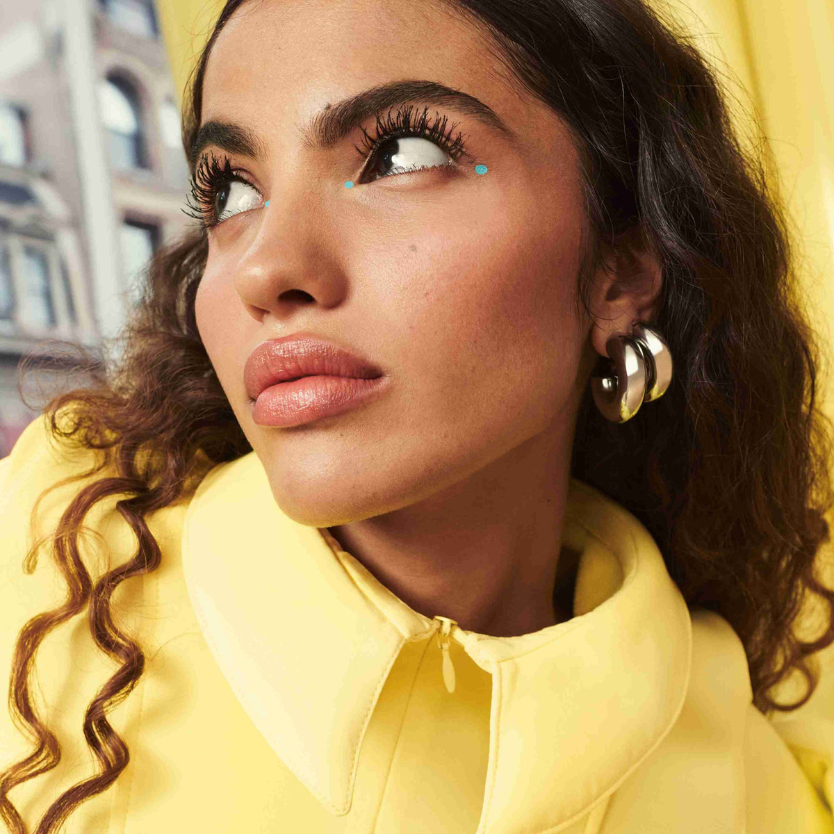 Model wearing Maybelline Colossal Bubble Mascara for defined, separated and voluminous lashes.