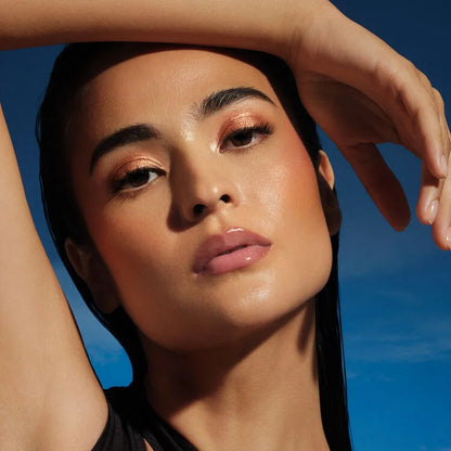 Model wearing NARS Hot Escape Cheek Palette with bronzed summer makeup look
