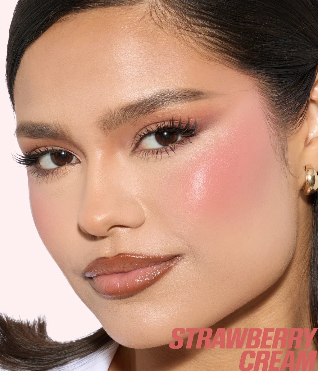 Model wearing Huda Beauty Blush Filter in Strawberry Cream