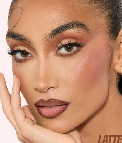 Model wearing Huda Beauty Blush Filter in Latte