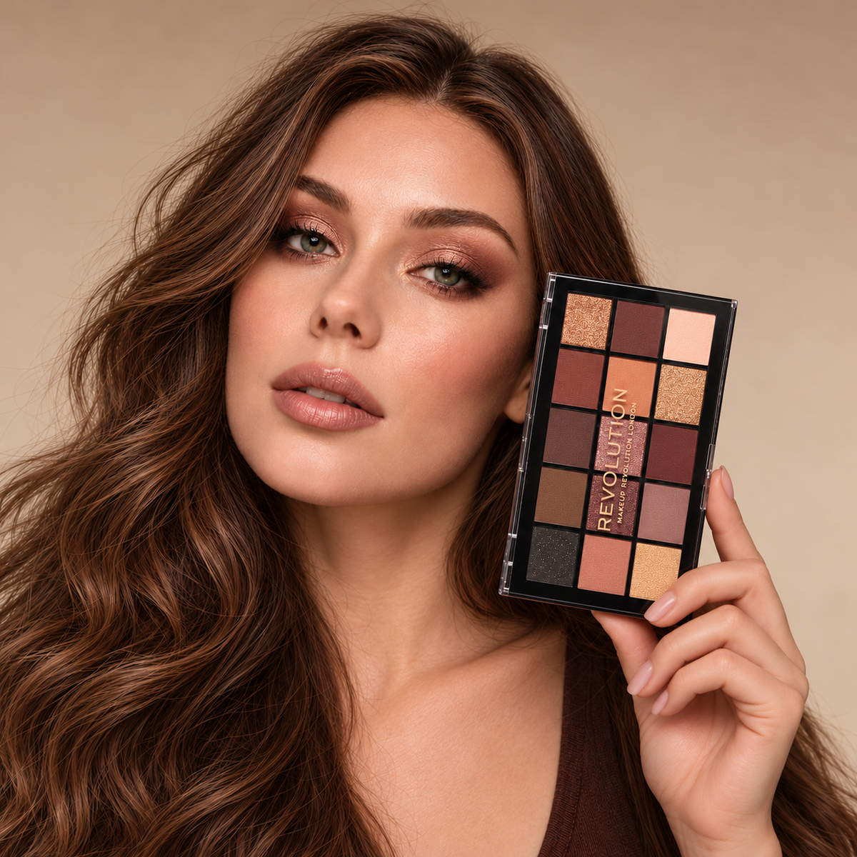 Model holding Revolution Reloaded Velvet Rose Palette beside her face with warm bronze eye makeup