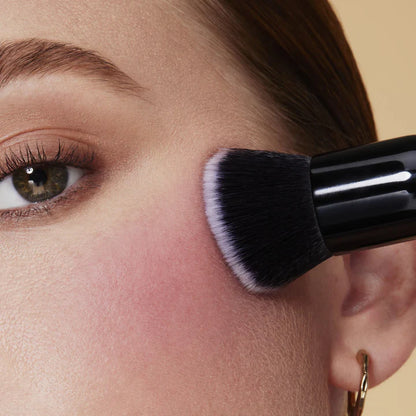 e.l.f. Camo Liquid Blush blended on cheek with blush brush