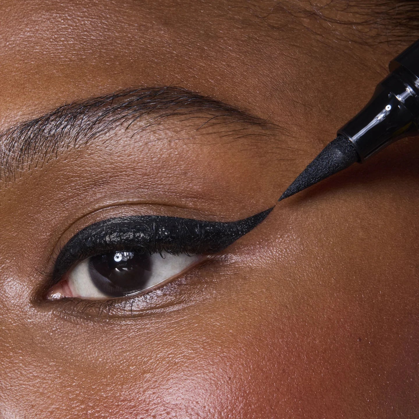 e.l.f. Wide Glide Eyeliner Pen creating bold black winged eyeliner look